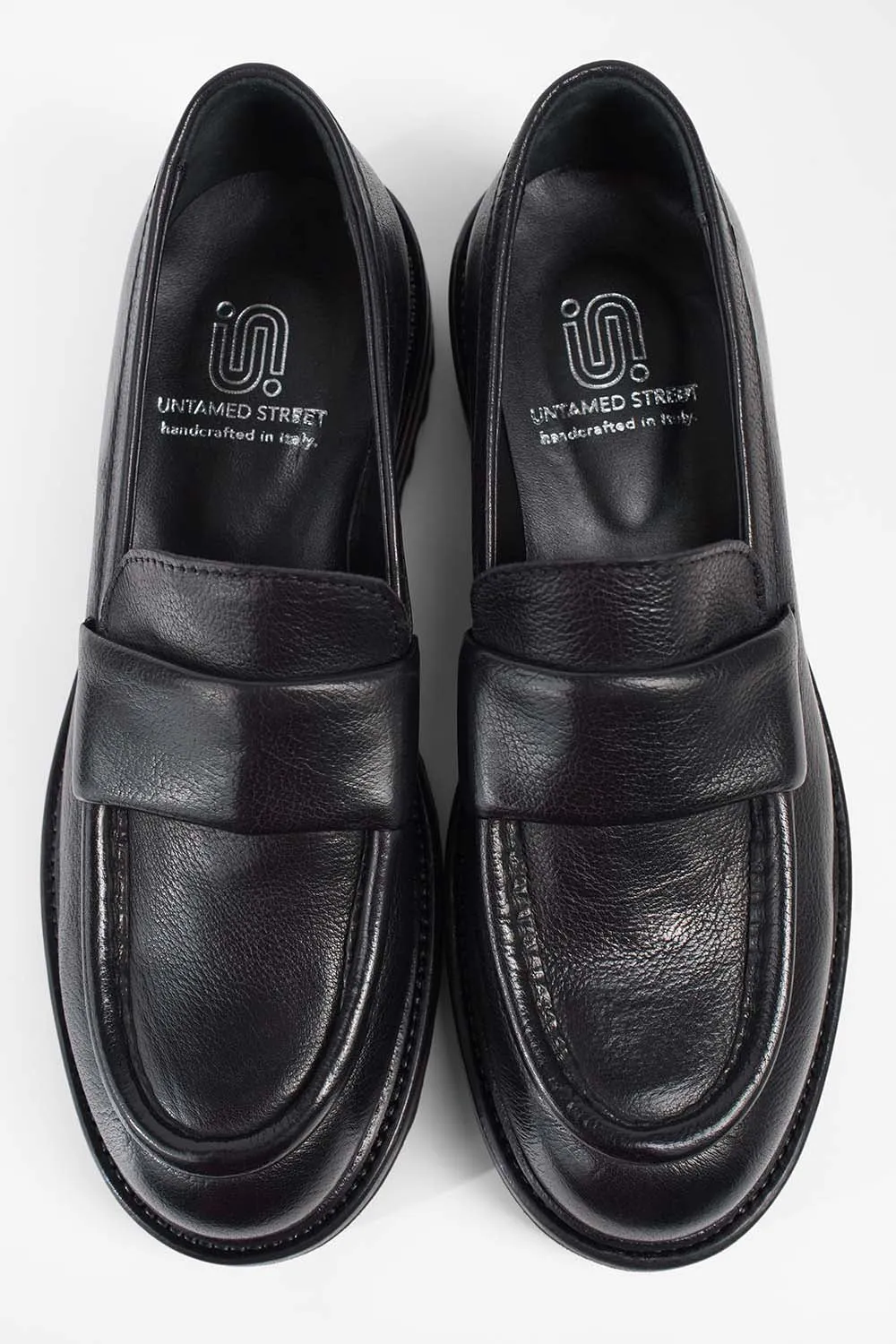 CAMDEN jet-black slip on shoes.