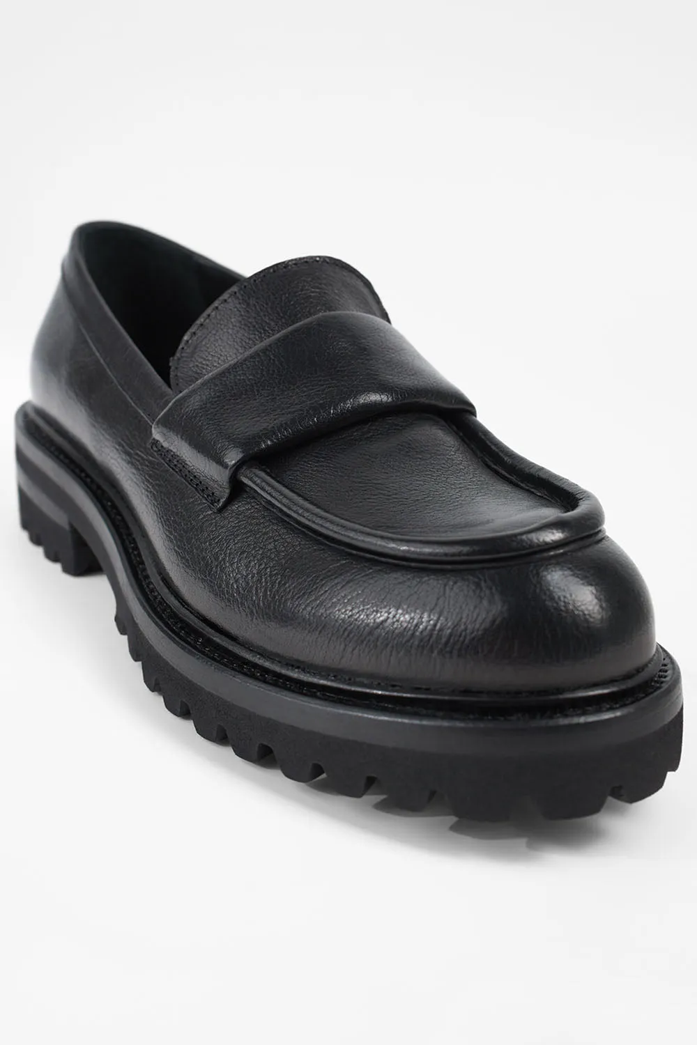 CAMDEN jet-black slip on shoes.