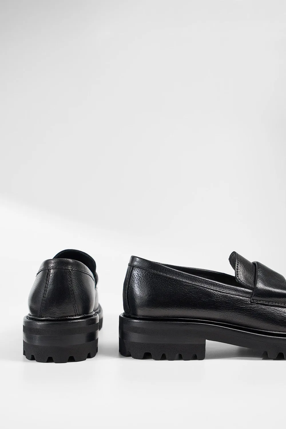 CAMDEN jet-black slip on shoes.